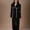 COMODE X KVARIANI Black Blazer with white ruffle details