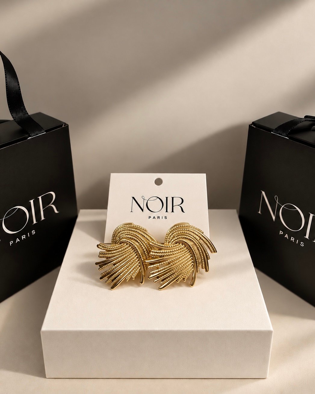 NOIR Gold "Wave" Earrings - Image 3